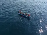 Five guests using the inflatable canoe