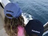 Two young guests looking over the side of Mowana Yacht